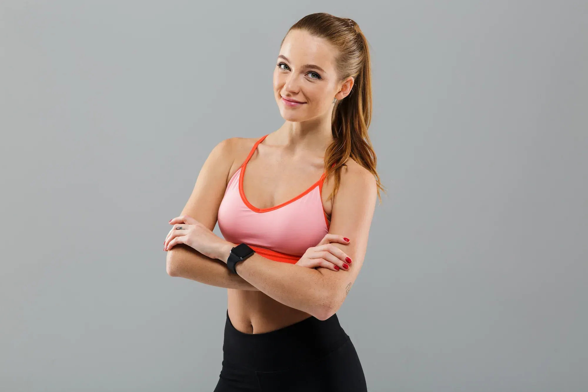 Athletic young woman confidently showing results from PRP treatments for wellness