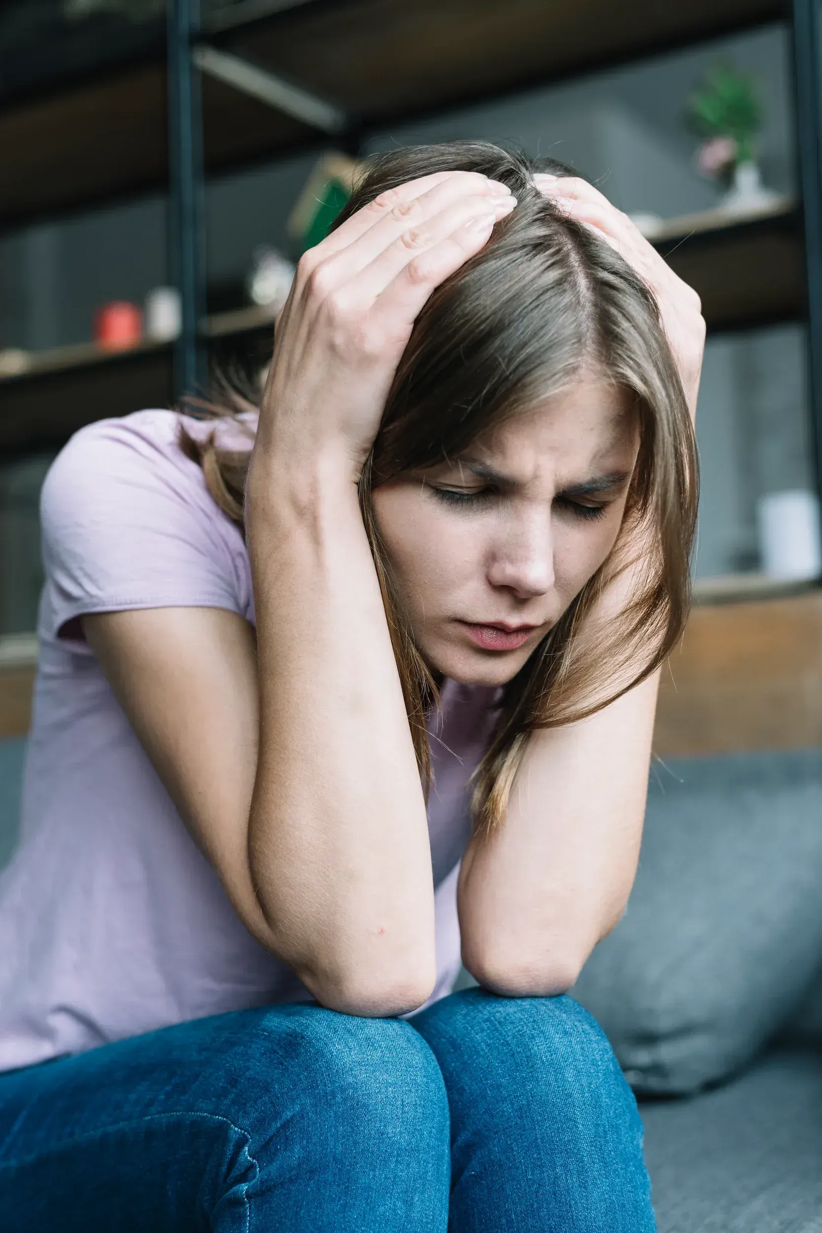 Person concerned about anxiety symptoms at Refresh TMS Weston