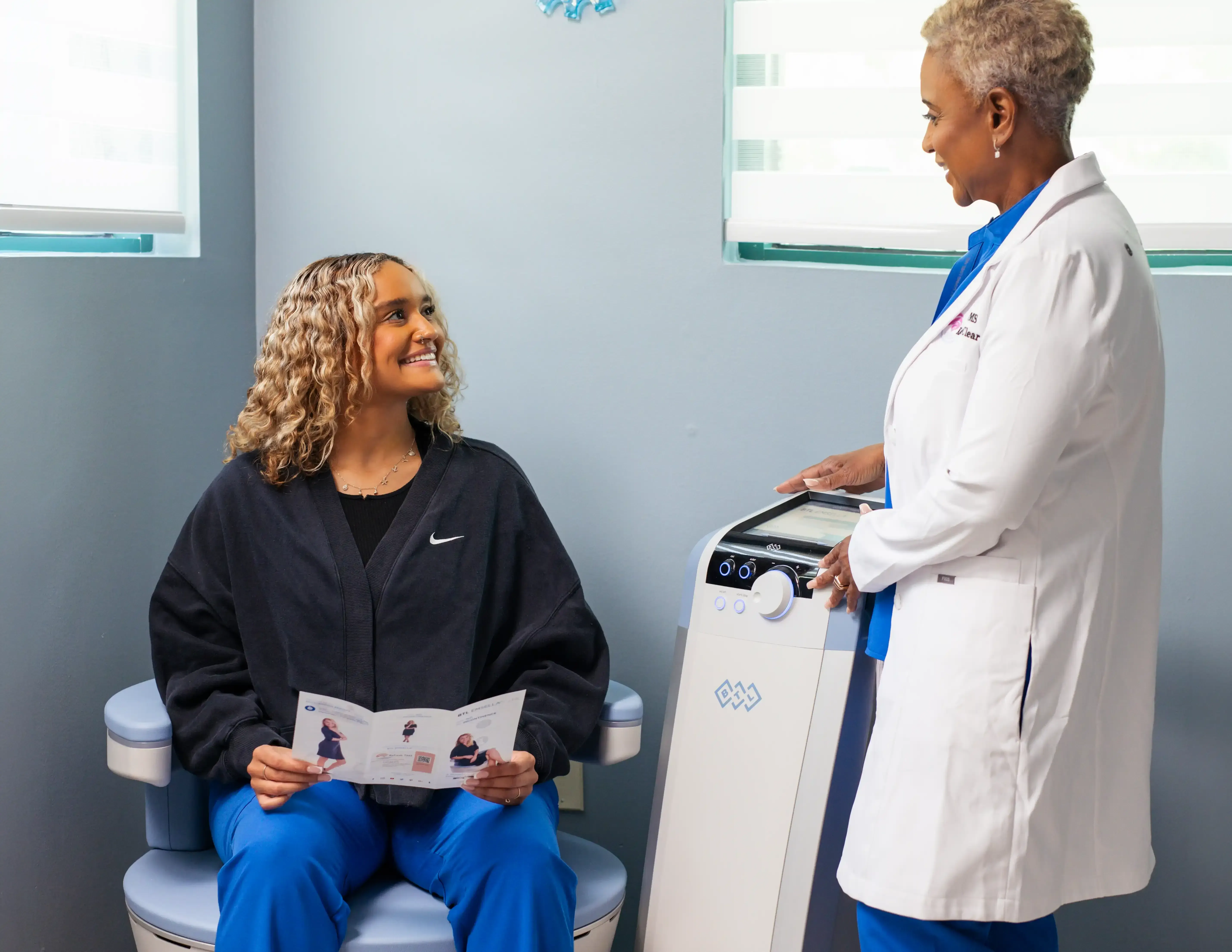 Woman sitting comfortably on BTL Emsella chair during non-invasive pelvic floor therapy session at Refresh TMS in Weston FL